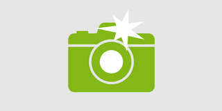 Icon: Fotokamera, die gerade auslöst